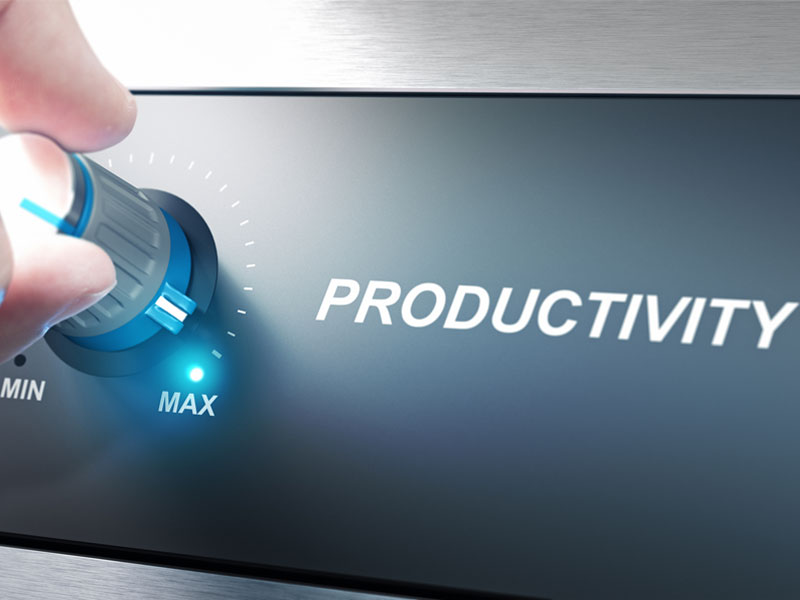 A dial being turned to the max setting with the word productivity beside the dial.